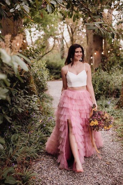 Spring wedding inspiration with colourful flowers and a pink ruffled wedding skirt and short wedding dress by Kyrstin Healy Photography