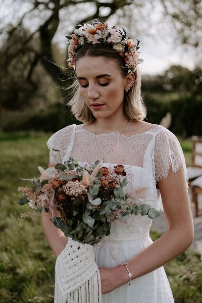 Bride wearing a dried flower headband for a boho wedding.