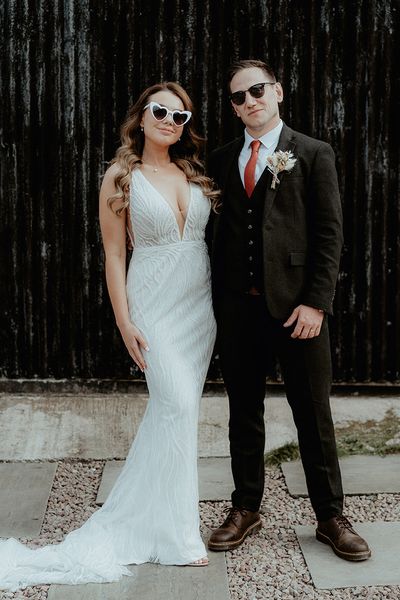 Bride in retro sunglasses with groom for wedding at Rhyse Farm.