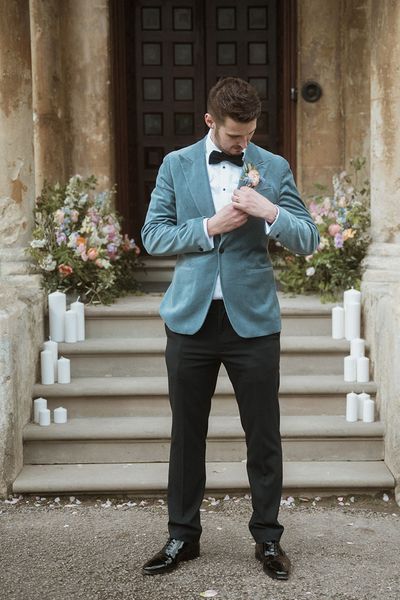 Groom in a blue velvet blazer for country house wedding