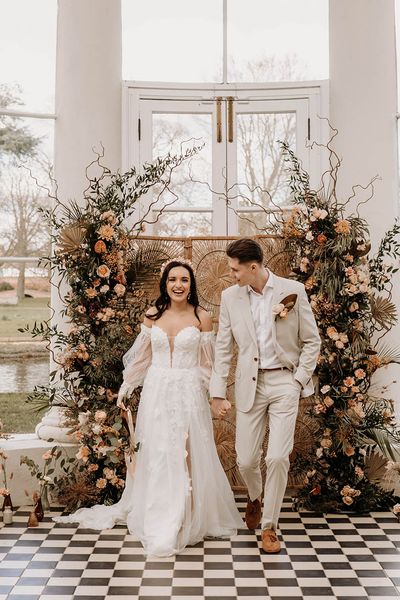 Gunnersbury Park Spring wedding inspiration with a muted colour palette, wildflowers and wedding dress with detachable sleeves