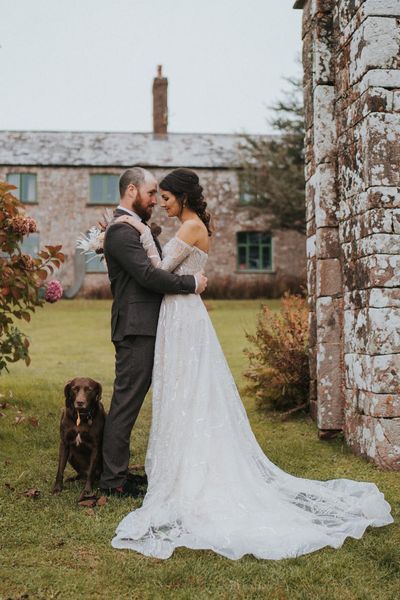 Bride in celestial and sparkly Zavana Couture wedding dress for rustic wedding. 