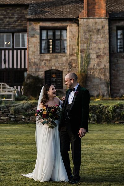 brinsop court manor house and barn wedding with smiling bride and groom.