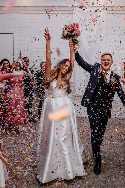 Stylish London wedding at The Loft Studios planned in 4 months with a gospel flash mob choir, 1KG of confetti and pink bridesmaid dresses.