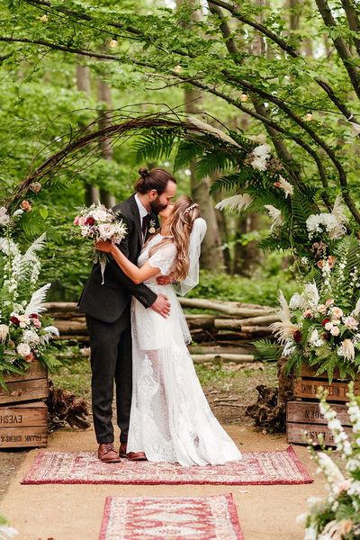 Rainy The Dreys Kent woodland wedding with high low bespoke wedding dress, colourful flowers & carnival games by Kirsty MacKenzie Photography