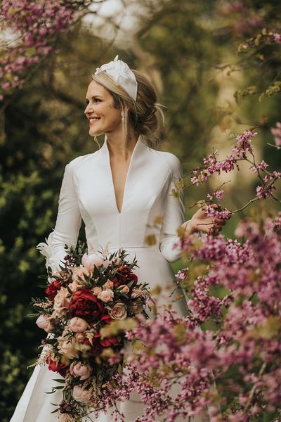 Bride in traditional wedding dress for classic Stowe House wedding.