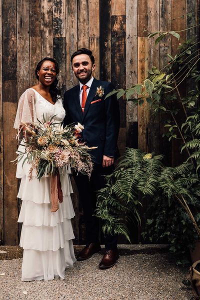 Black bride in a bespoke wedding dress at 100 Barrington wedding venue with pampas grass decor