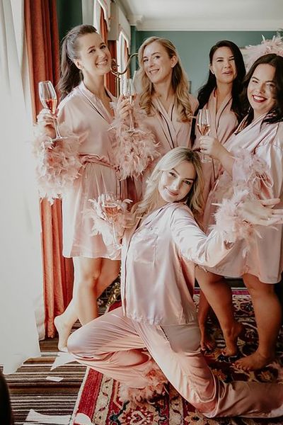 pink satin robes pjs with feathers The Kensingto Photographer