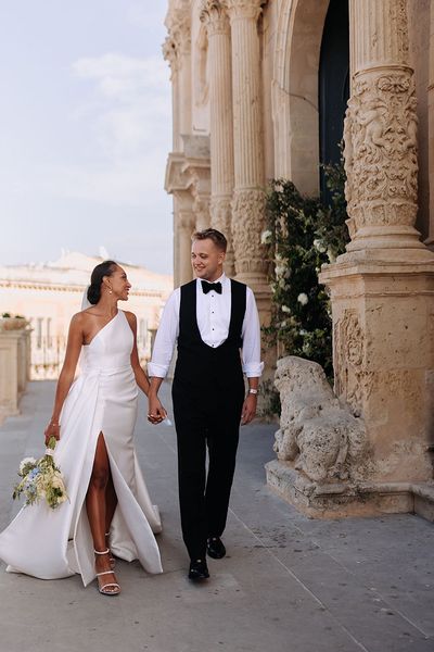 Stylish Jane Hill Bridal gown at Borgo Del Carato Italian destination wedding with blue bridesmaid dresses and flowers by Studio Westlake