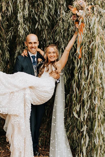 Duddon Mill Farm wedding with the bride in a lace wedding dress.