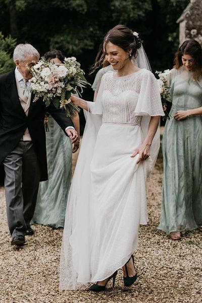 Classic Kelmarsh Hall wedding with green bridesmaid dresses, morning suits and joint speeches.