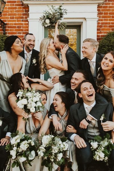 Villiers Barn wedding with the wedding party wearing green themed outfits