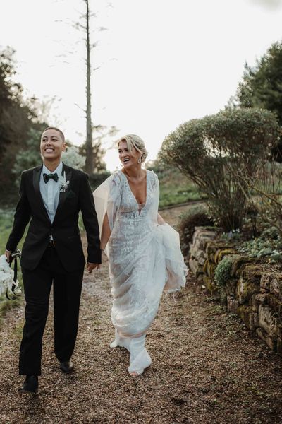 hodsock Priory LGBTQI+ wedding with lace wedding dress, tuxedo and column gypsohila clouds