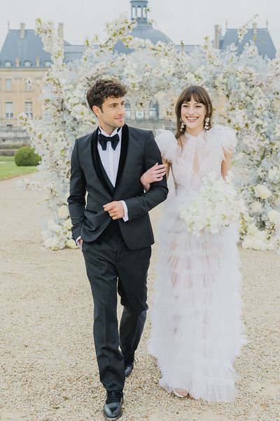 Bride and groom in Haute Couture cotton for wedding a the chateau in France.