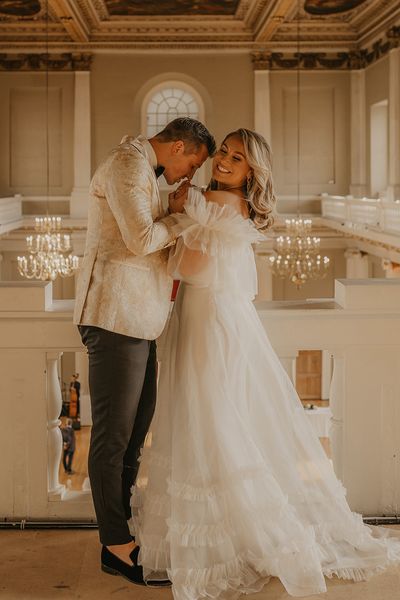 Banqueting House in Whitehall, London for American couple, Abbie and Kurt. Complete with Halfpenny London wedding dress and custom gold tuxedo.