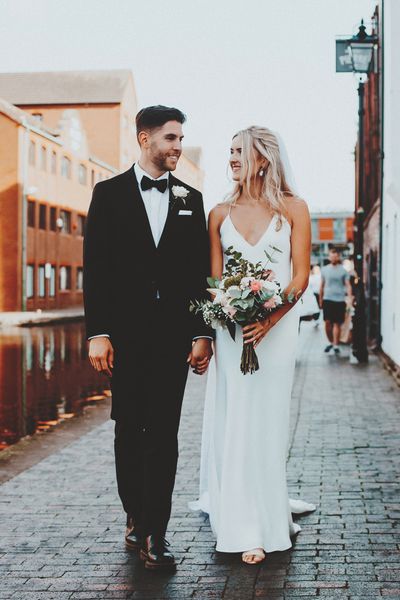 Intimate Gas Street church wedding with the bride in a slip wedding dress and the groom in a tuxedo 