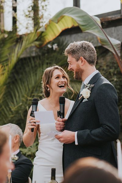 bride and groom performing their joint wedding speech