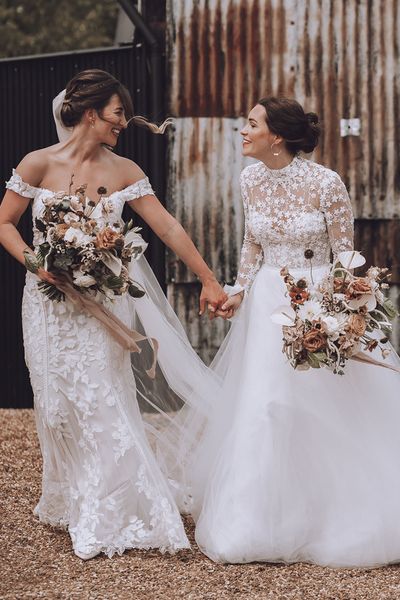 Stone Barn wedding with the brides in flower wedding dresses