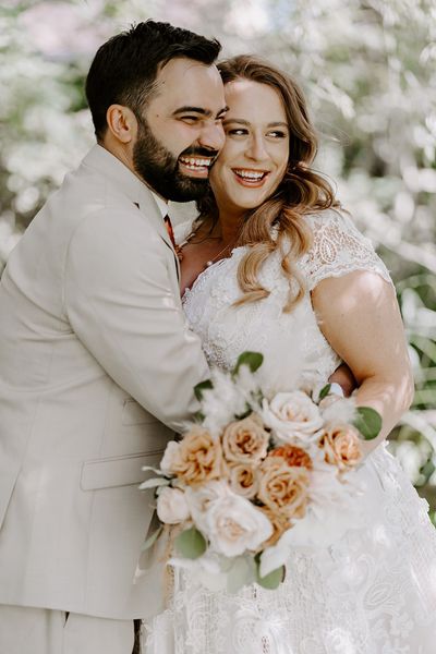 Bride and groom embrace for their weddings under 40k