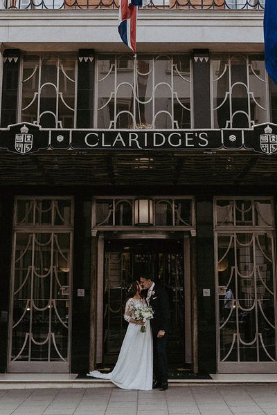 Claridge's wedding in London with black tie dress code and bride in maternity wedding dress.