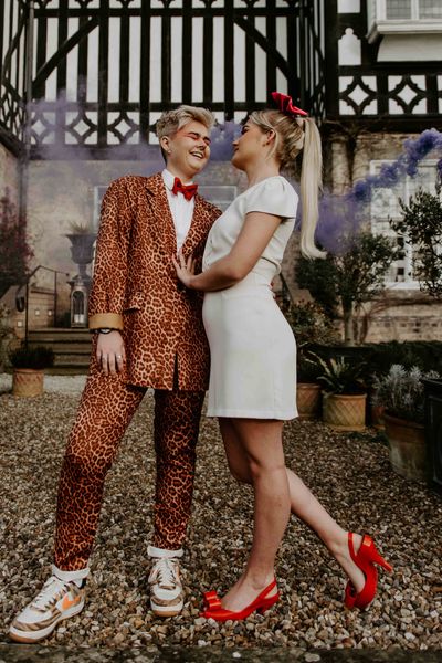 Pink and orange fun, retro LGBTQ+ wedding inspiration with roller skates, disco balls and a tulip bouquet by Lucy Dennis Photography