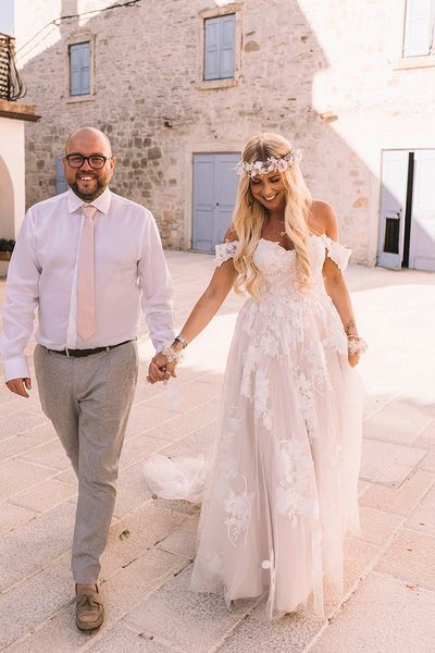 Bride and groom at their Croatia wedding with a boho theme.