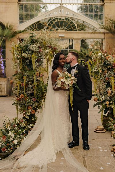 Syon Park wedding with black tie dress code, Nigerian money dance and flower columns