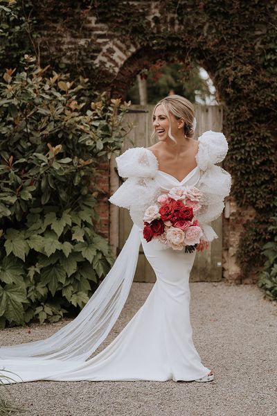 Red and pink wedding theme with the bride wearing a Chosen by Kyha wedding dress.