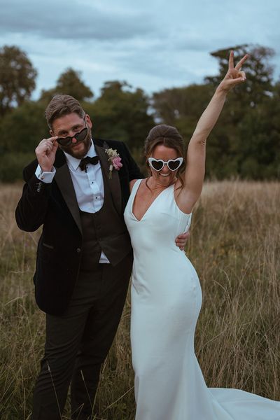 The Pear Tree Purton wedding with bride and groom wearing fun sunglasses.