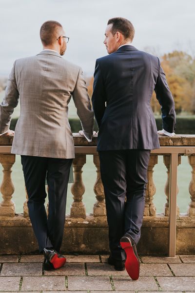 Louboutin groom shoes worn by two grooms for their country house gay wedding.