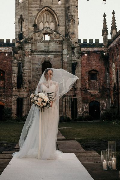 Wedding Inspiration at St Luke's Bombed Out Church in Liverpool with white flowers, festoon lights and drapes.