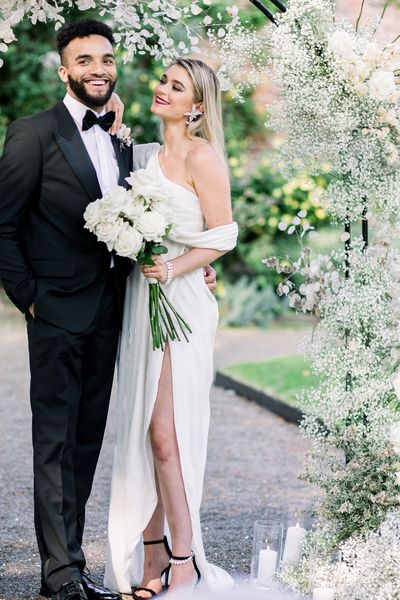 Sophisticated summer Garthmyl Hall wedding with white flowers and black-tie fashion