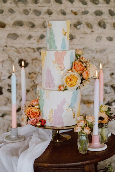 Pastel painted iced wedding cake.