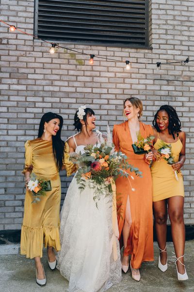 Mustard and orange wedding inspiration at an industrial wedding venue 