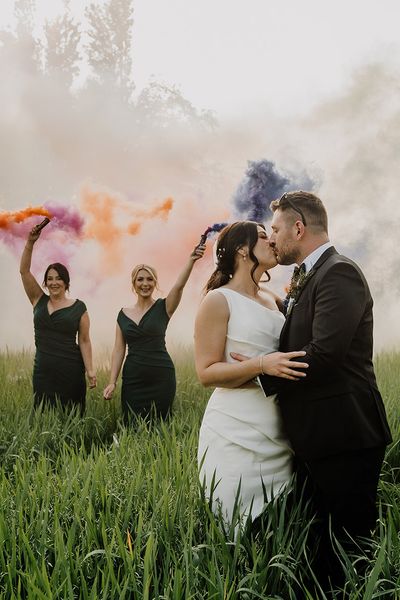 Bride and groom have smoke bomb photoshoot at Larkspur Lodge wedding.