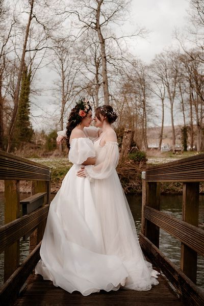 Ethereal wedding dress and inspiration at Mapledurham House and Estate with two brides and romantic flowers by Katherine And Her Camera