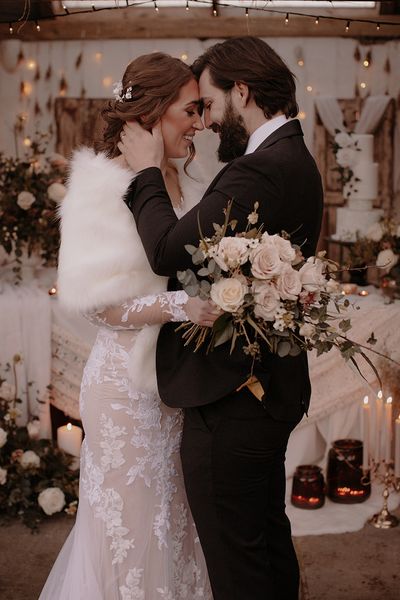 Bride and groom for their black tie rustic winter wedding.