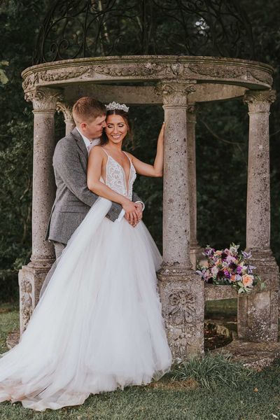 Rustic summer wedding complete with a fun hydration station and a pink and grey colour scheme.