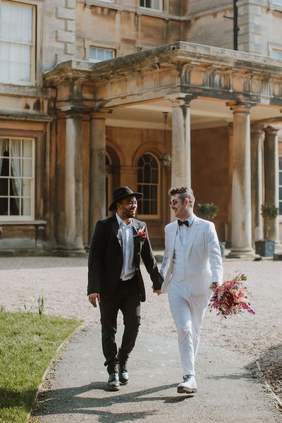 red, pink, black and white groom suit ideas for LGBTQI+ inspiration at Prestwold Hall Barns