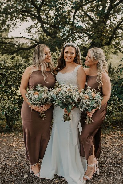 bride and bridesmaids in brown bridesmaid dresses at Chycara wedding