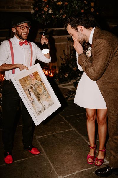 a live wedding illustrator produces a painting wedding keepsake