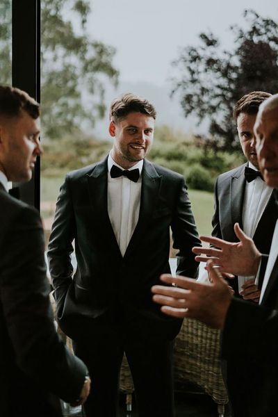 groom in black tuxedo ben barron photography