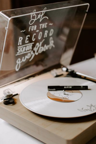 Record player alternative wedding guest book idea.