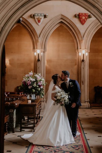 Bride and groom kiss for their classic wedding at Maften Hall.