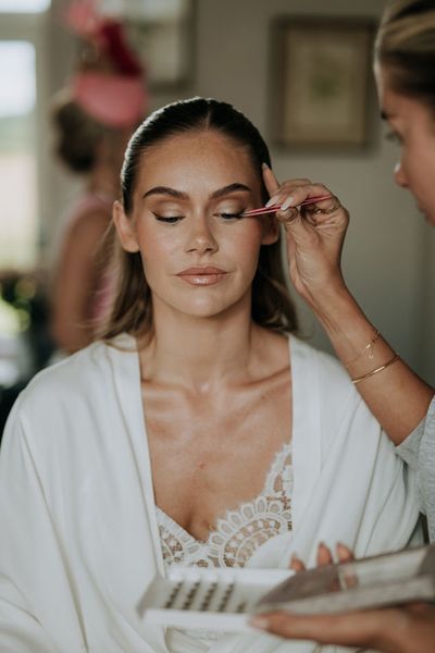 bride-gets-makeup-done-for-wedding-day-pre-wedding-beauty