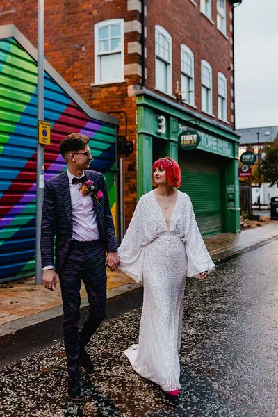 bride-wearing-asos-sequin-bat-wing-wedding-dress-with-groom-in-purple-checkered-suit-Dandrew-Photography