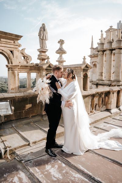 bride-and-groom-at-luxe-monochrome-wedding-with-dried-flowers