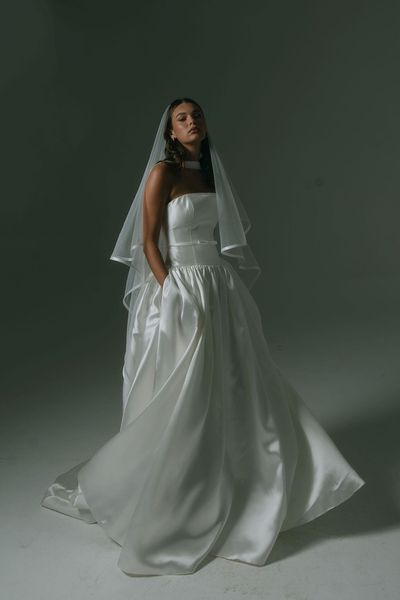 drop waist wedding dress with strapless neckline, boned bodice, thin belt and full skirt by Hera Couture