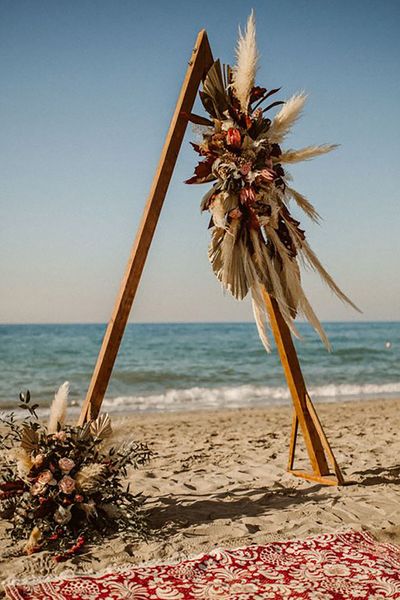 beach picnic set-up for beach honeymoon location or destination wedding