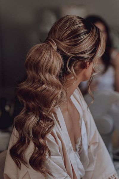 Bride with delicate wedding hair updo